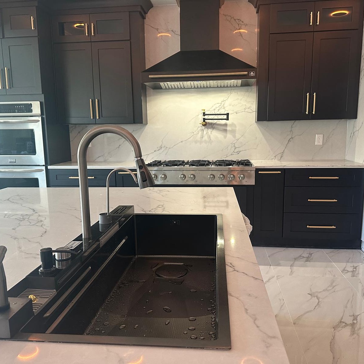 Finished modern kitchen remodel by L.R. INTERIORS